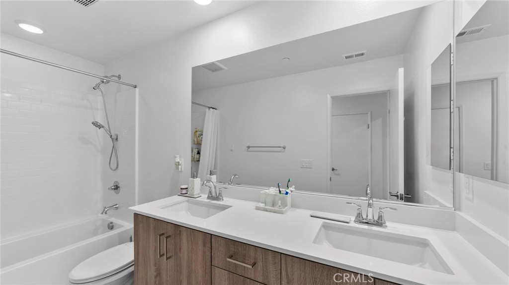 104 Lipizzan Lane Fallbrook, CA 92028 - Photo 26 of 53 a bathroom with a sink double vanity granite tub shower and a mirror