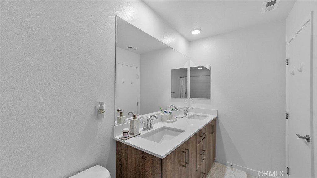 104 Lipizzan Lane Fallbrook, CA 92028 - Photo 29 of 53 a bathroom with a sink and a mirror