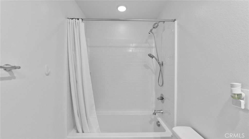 104 Lipizzan Lane Fallbrook, CA 92028 - Photo 30 of 53 a bathroom with a shower and a bath tub