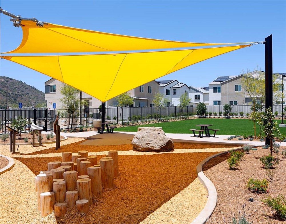 104 Lipizzan Lane Fallbrook, CA 92028 - Photo 48 of 53 a view of a swimming pool with a lounge chairs