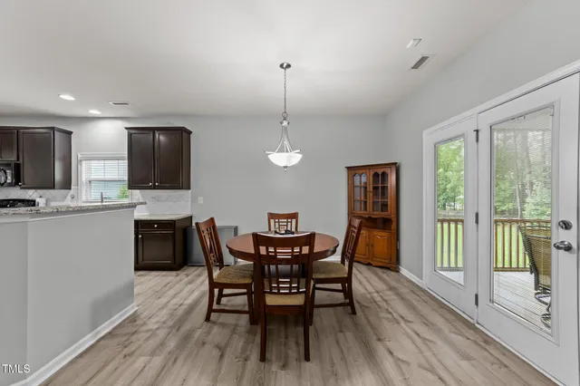 a kitchen with a sink stove top oven and cabinets
