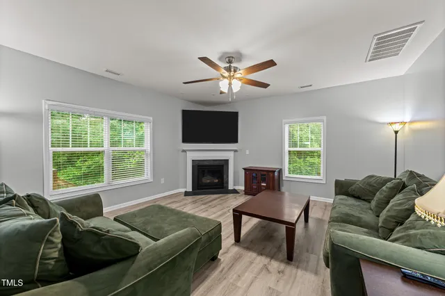 a kitchen with kitchen island granite countertop a sink counter top space appliances and cabinets