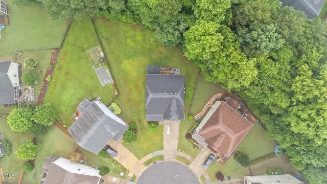 an aerial view of a house with a garden
