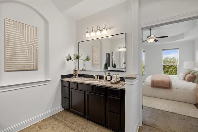 a bathroom with a double vanity sink and a mirror