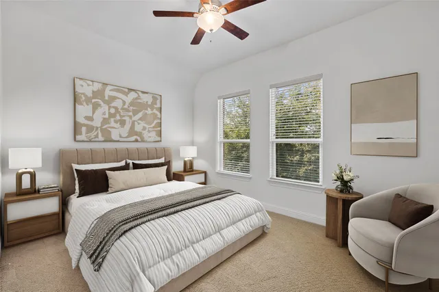 a spacious bedroom with a bed and a large window