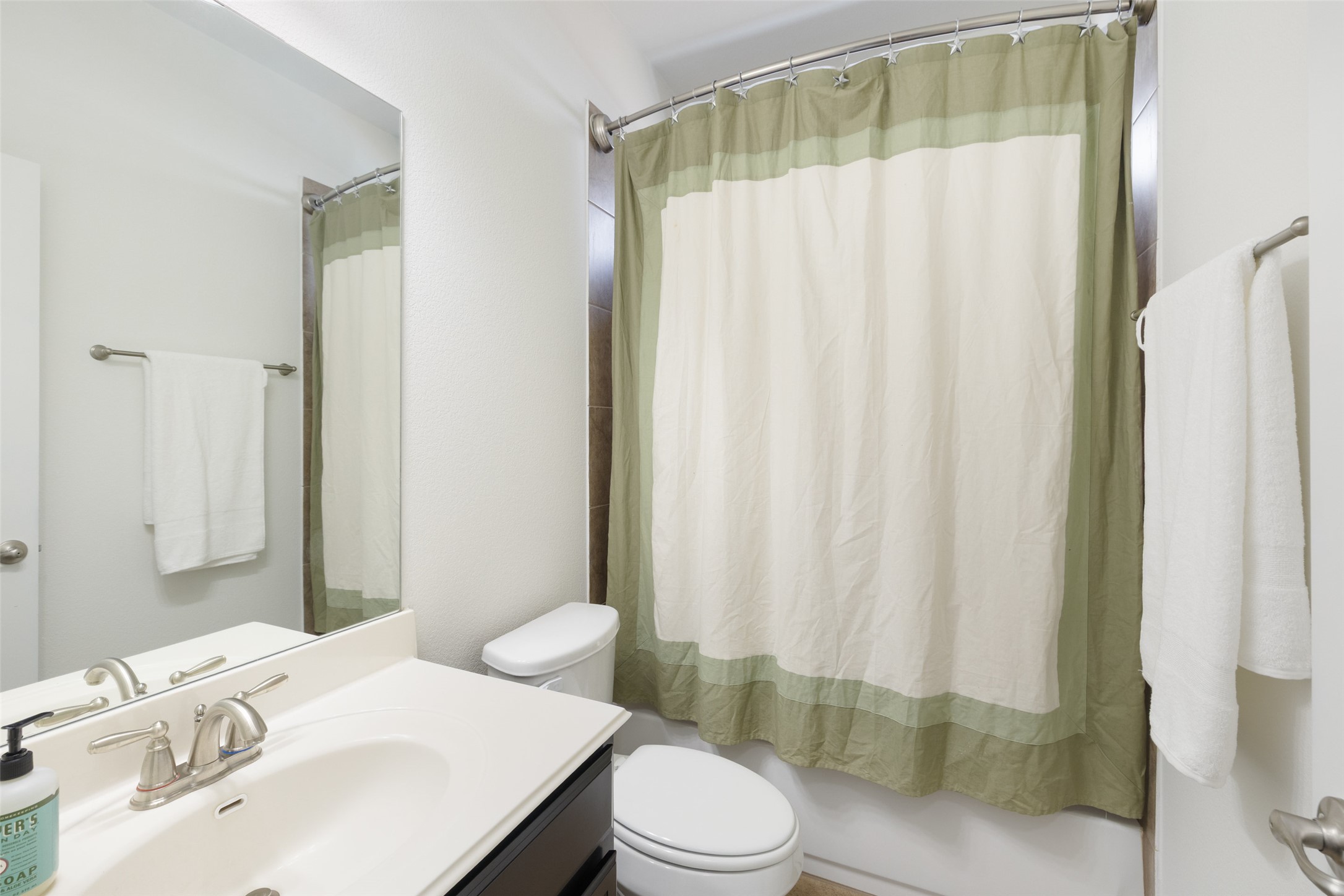 5612 Cherokee Draw Road Austin, TX 78738 - Photo 21 of 31 a bathroom with a sink and toilet