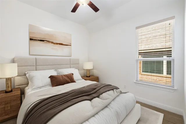 a bedroom with a bed and window