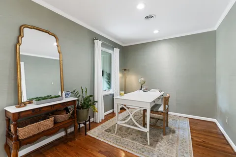 a room with a table and chairs