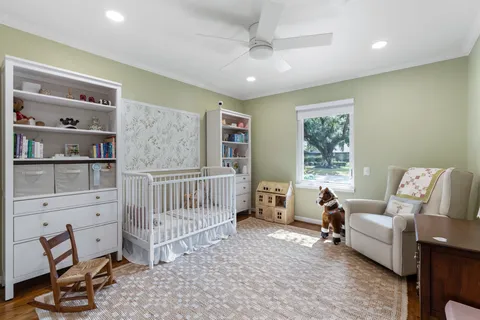 a bedroom with furniture and a window