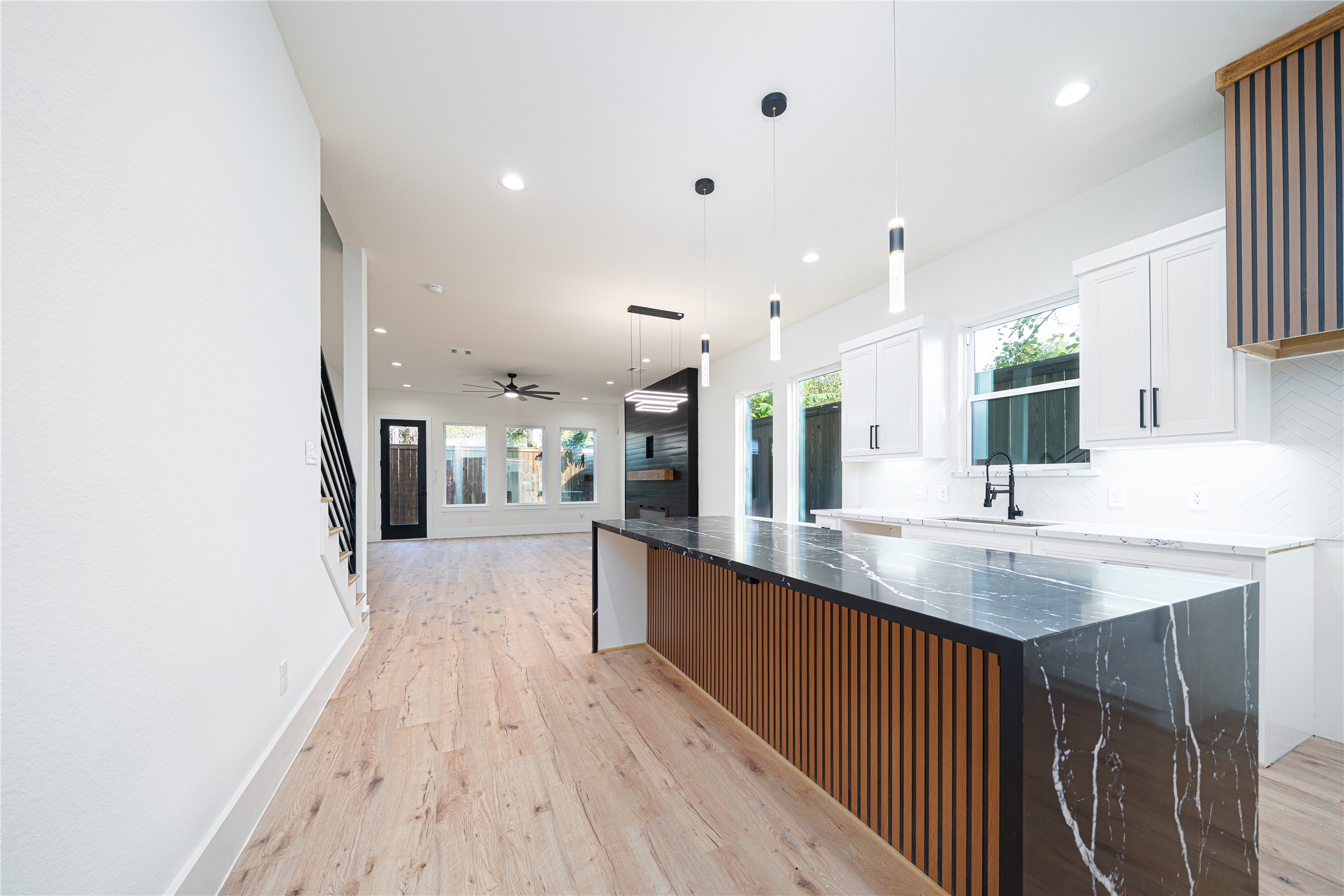 2429 Parker Road Houston, TX 77093 - Photo 6 of 17 a kitchen with stainless steel appliances granite countertop a sink stove and wooden floor