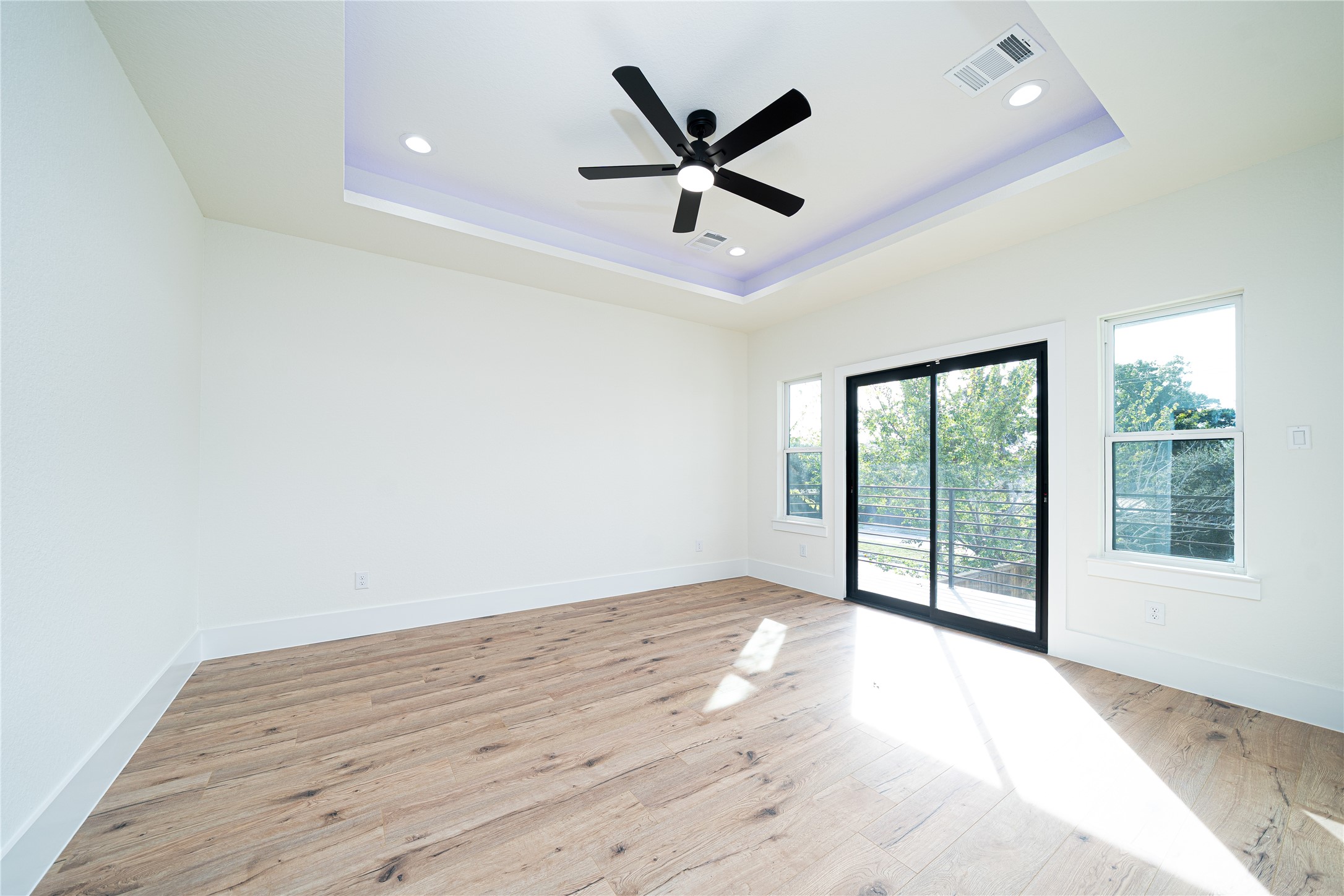 2429 Parker Road Houston, TX 77093 - Photo 7 of 17 wooden floor in an empty room with a window