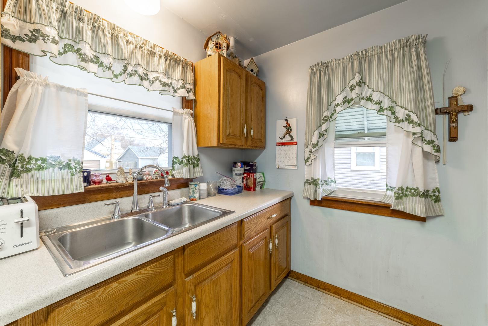 17949 Escanaba Avenue Lansing, IL 60438 - Photo 12 of 45 a kitchen that has a sink and a stove