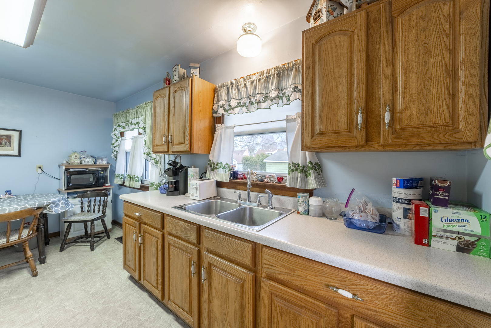 17949 Escanaba Avenue Lansing, IL 60438 - Photo 14 of 45 a kitchen with a sink cabinets and window
