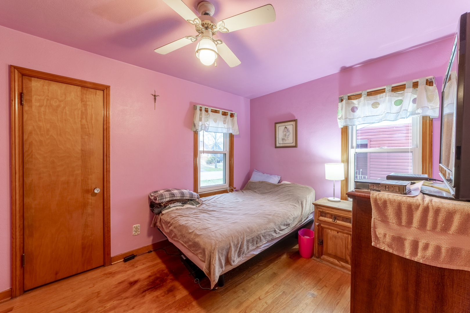 17949 Escanaba Avenue Lansing, IL 60438 - Photo 17 of 45 a bedroom with a bed and a chandelier