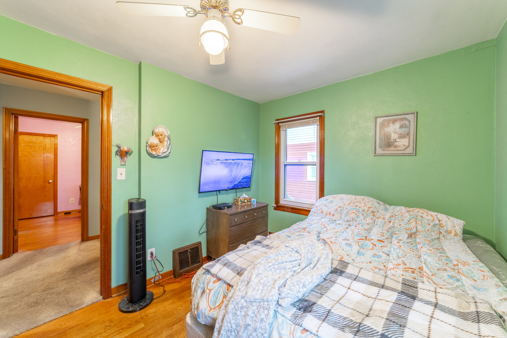 17949 Escanaba Avenue Lansing, IL 60438 - Photo 19 of 45 a bedroom with a bed and a table
