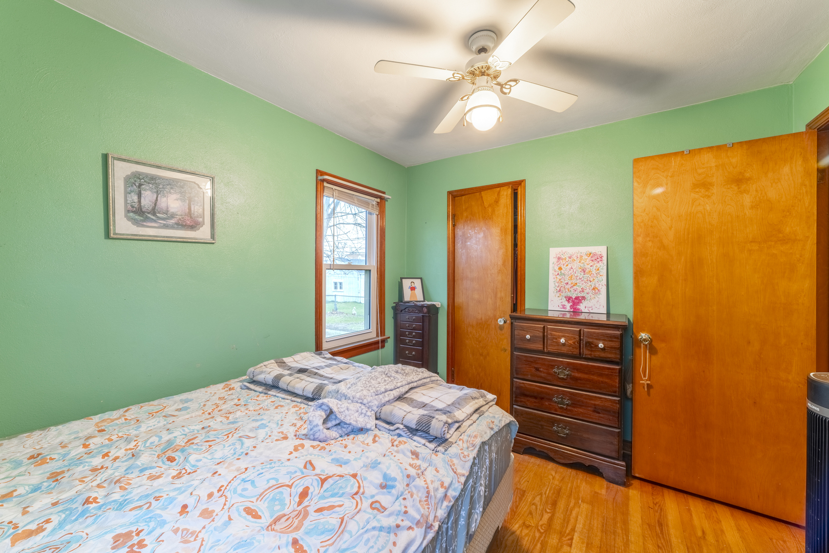 17949 Escanaba Avenue Lansing, IL 60438 - Photo 20 of 45 a bedroom with a bed and a dresser