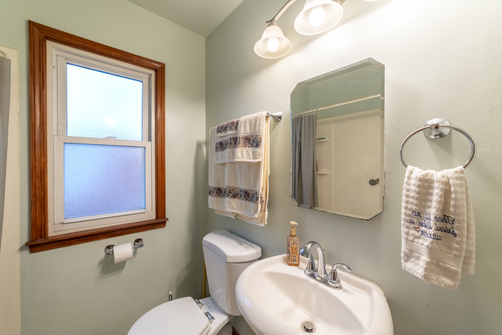 17949 Escanaba Avenue Lansing, IL 60438 - Photo 27 of 45 a bathroom with a toilet sink and mirror