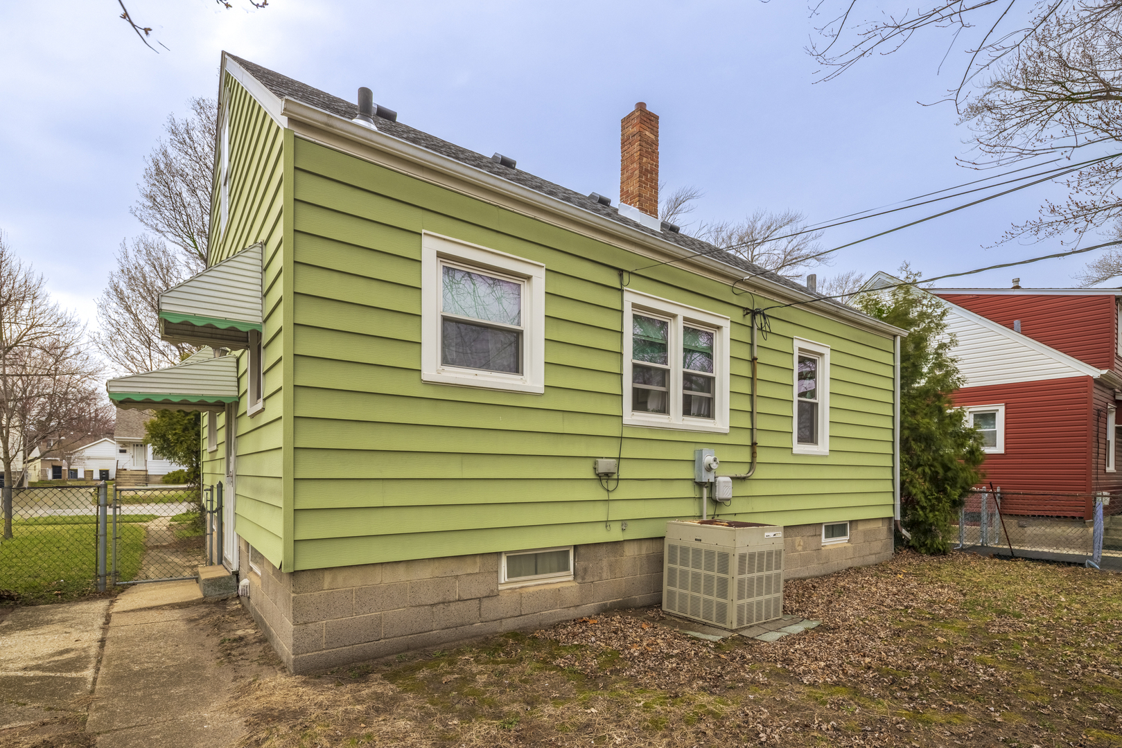17949 Escanaba Avenue Lansing, IL 60438 - Photo 36 of 45 a front view of a house with a garden