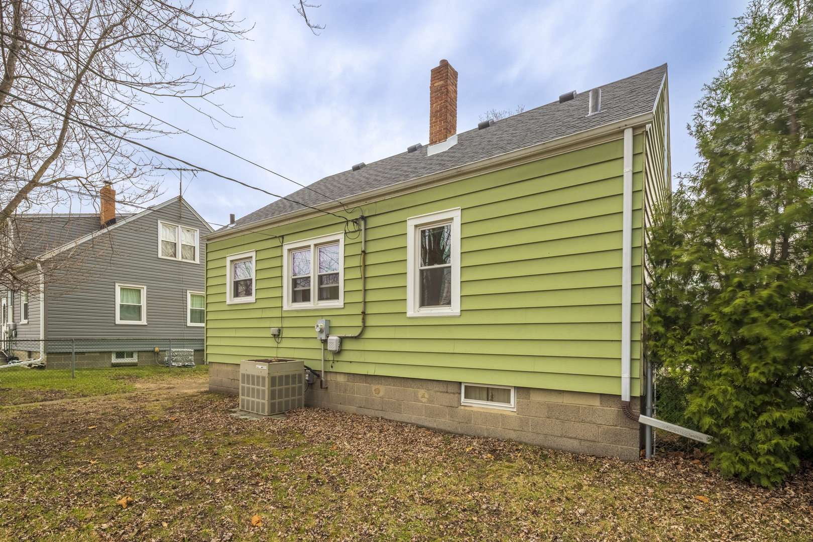 17949 Escanaba Avenue Lansing, IL 60438 - Photo 39 of 45 a front view of a house with a garden