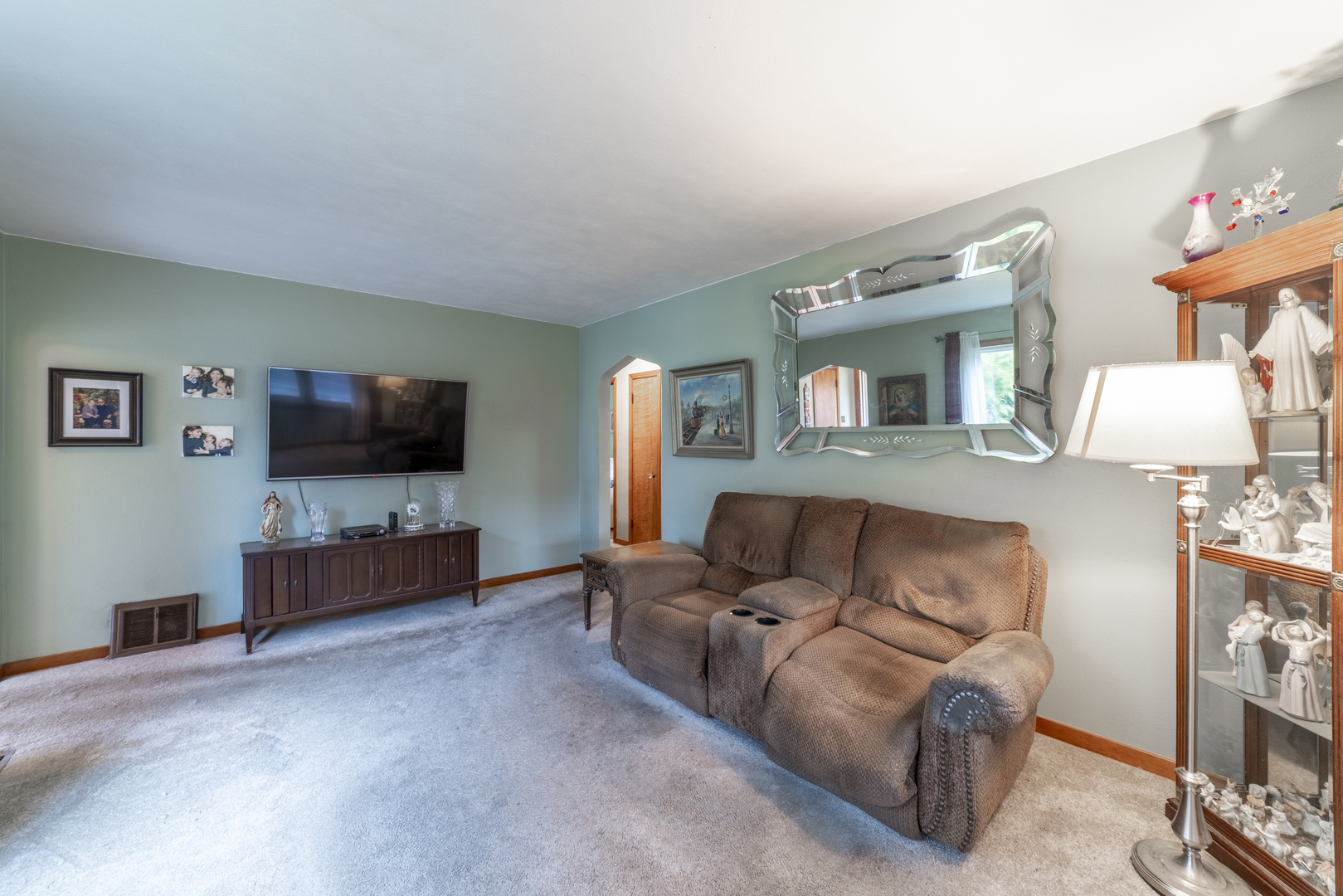 17949 Escanaba Avenue Lansing, IL 60438 - Photo 4 of 45 a living room with furniture and a flat screen tv