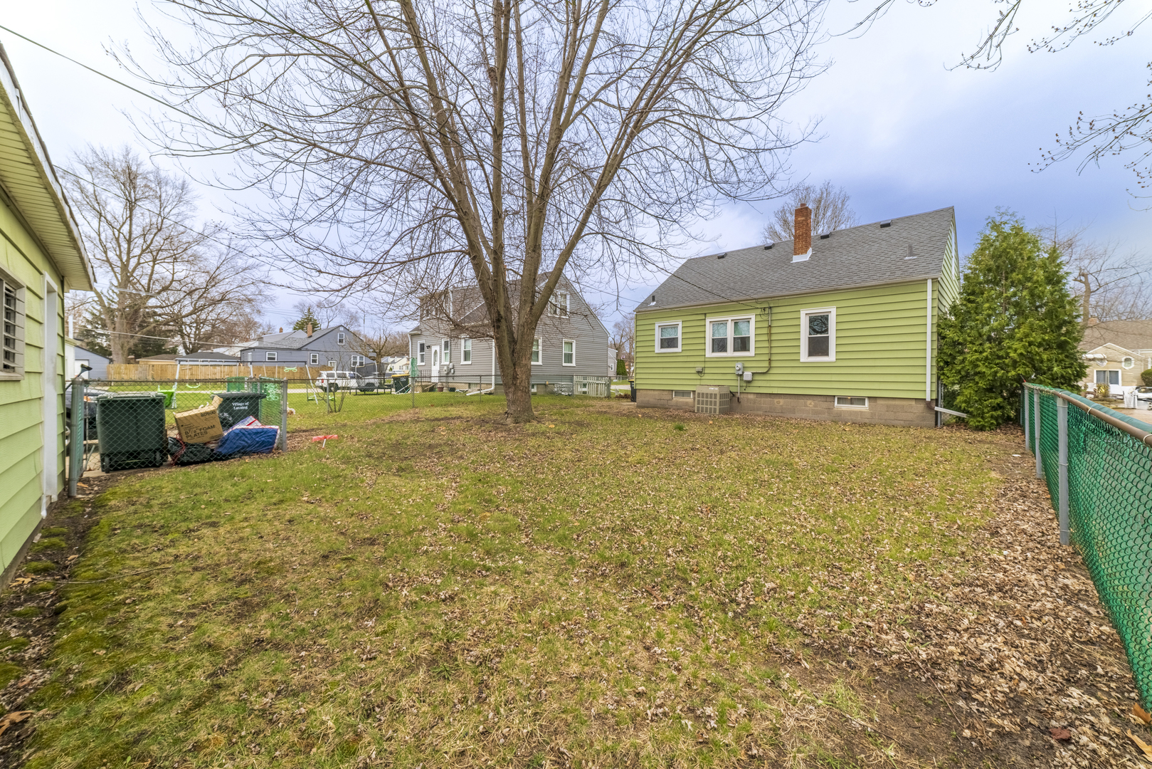 17949 Escanaba Avenue Lansing, IL 60438 - Photo 41 of 45 a front view of house with yard and trees around