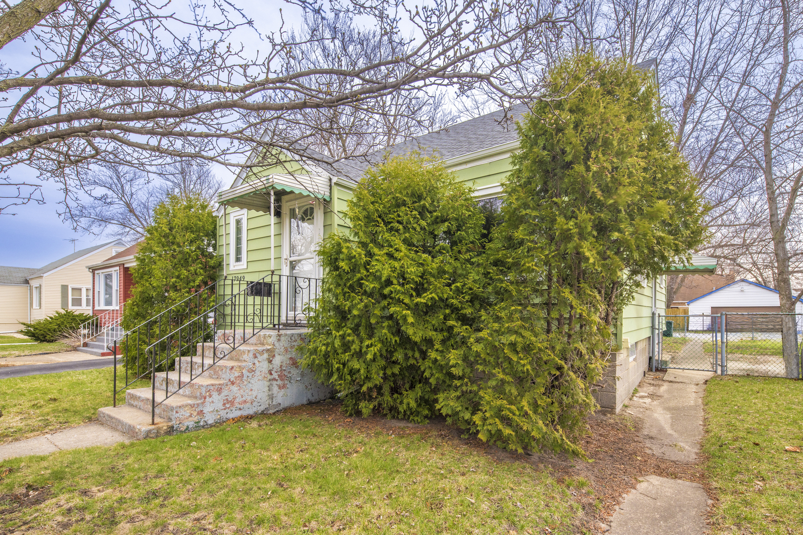 17949 Escanaba Avenue Lansing, IL 60438 - Photo 45 of 45 a view of a house with a small yard and large tree