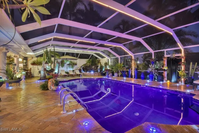 a view of a swimming pool with a seating space