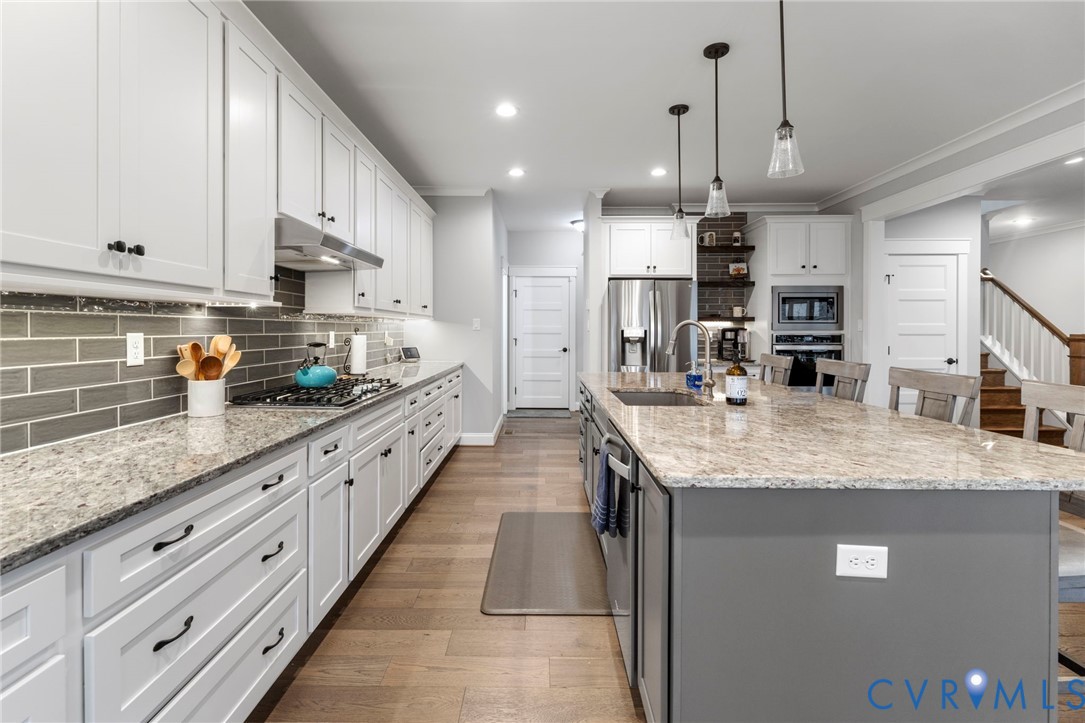 15060 Dordon Lane Midlothian, VA 23112 - Photo 14 of 35 a kitchen with stainless steel appliances granite countertop a sink a oven a stove and cabinets