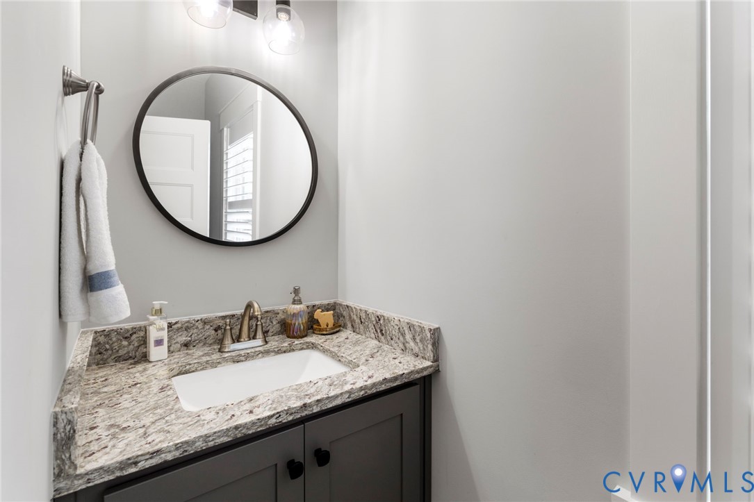 15060 Dordon Lane Midlothian, VA 23112 - Photo 19 of 35 a bathroom with a granite countertop sink and a mirror