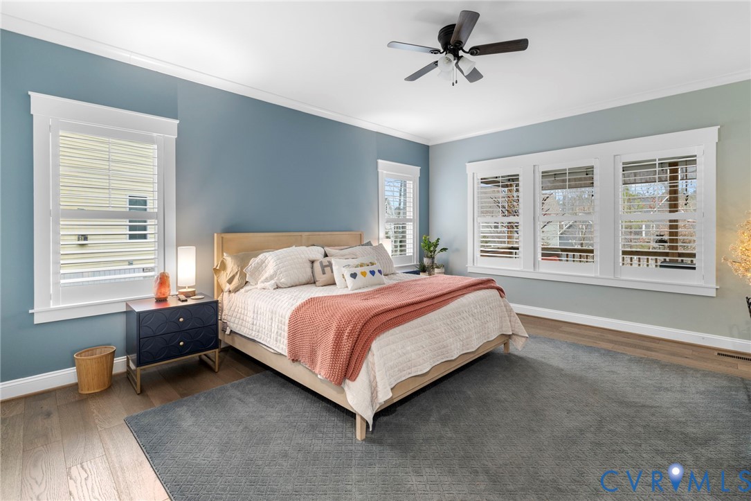 15060 Dordon Lane Midlothian, VA 23112 - Photo 20 of 35 a bedroom with a bed and wooden floor