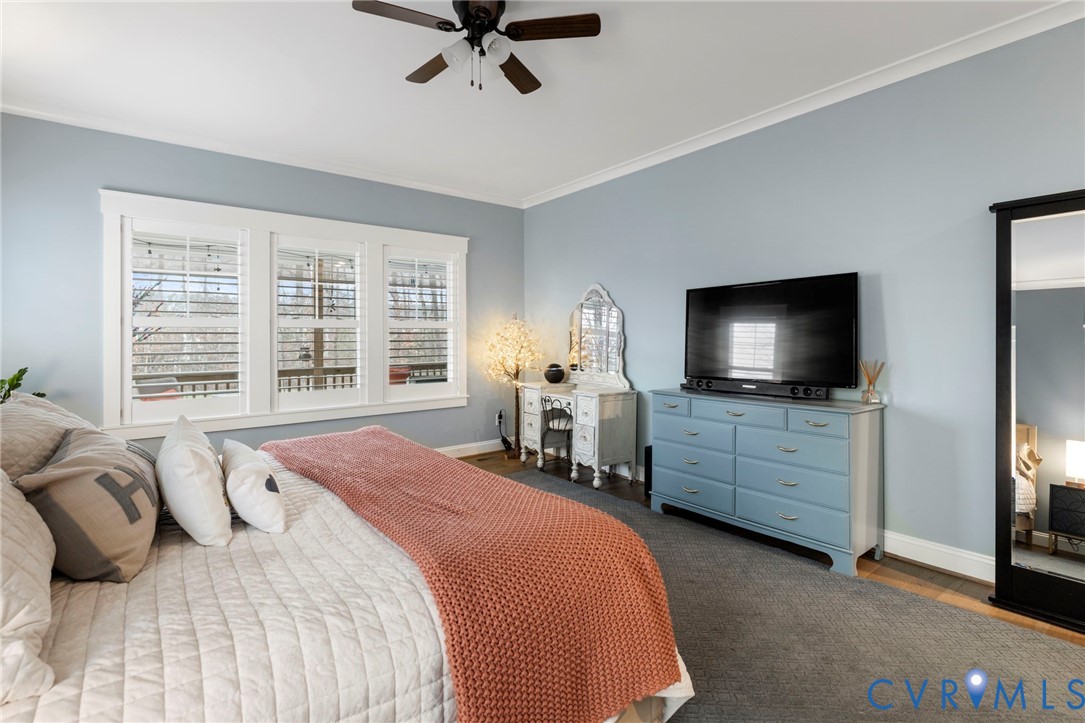 15060 Dordon Lane Midlothian, VA 23112 - Photo 21 of 35 a bedroom with a bed and a flat tv screen on dresser