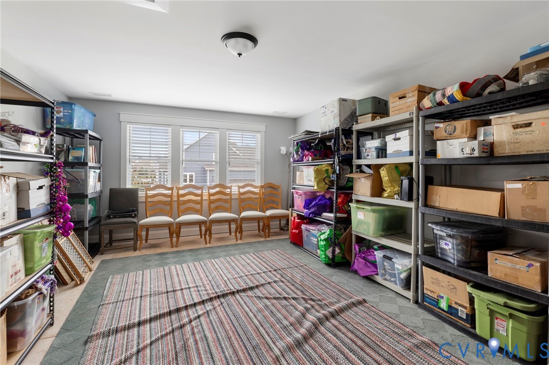 15060 Dordon Lane Midlothian, VA 23112 - Photo 25 of 35 a living room with lots of furniture and a flat screen tv