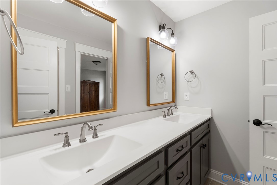 15060 Dordon Lane Midlothian, VA 23112 - Photo 27 of 35 a bathroom with a double vanity sink mirror and