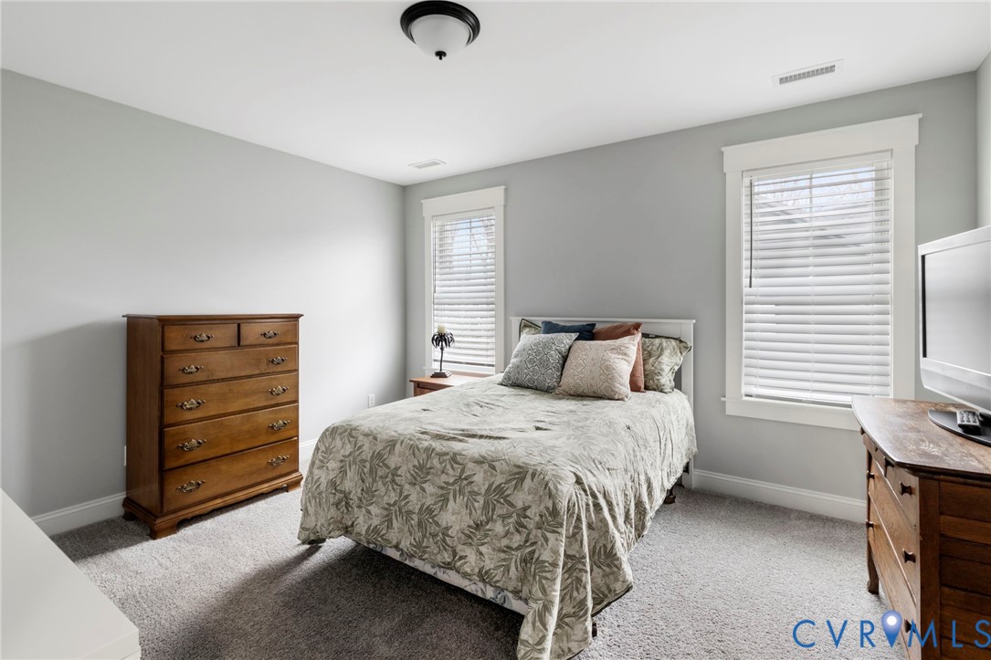 15060 Dordon Lane Midlothian, VA 23112 - Photo 30 of 35 a bedroom with a bed and a television