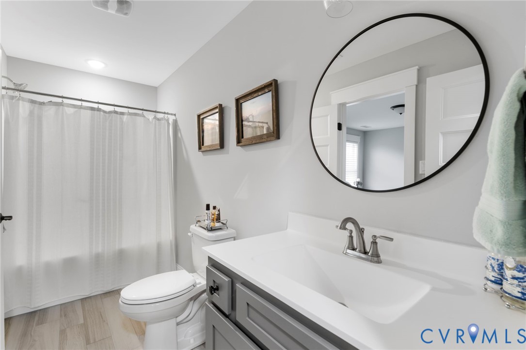 15060 Dordon Lane Midlothian, VA 23112 - Photo 31 of 35 a bathroom with a sink a toilet and a mirror
