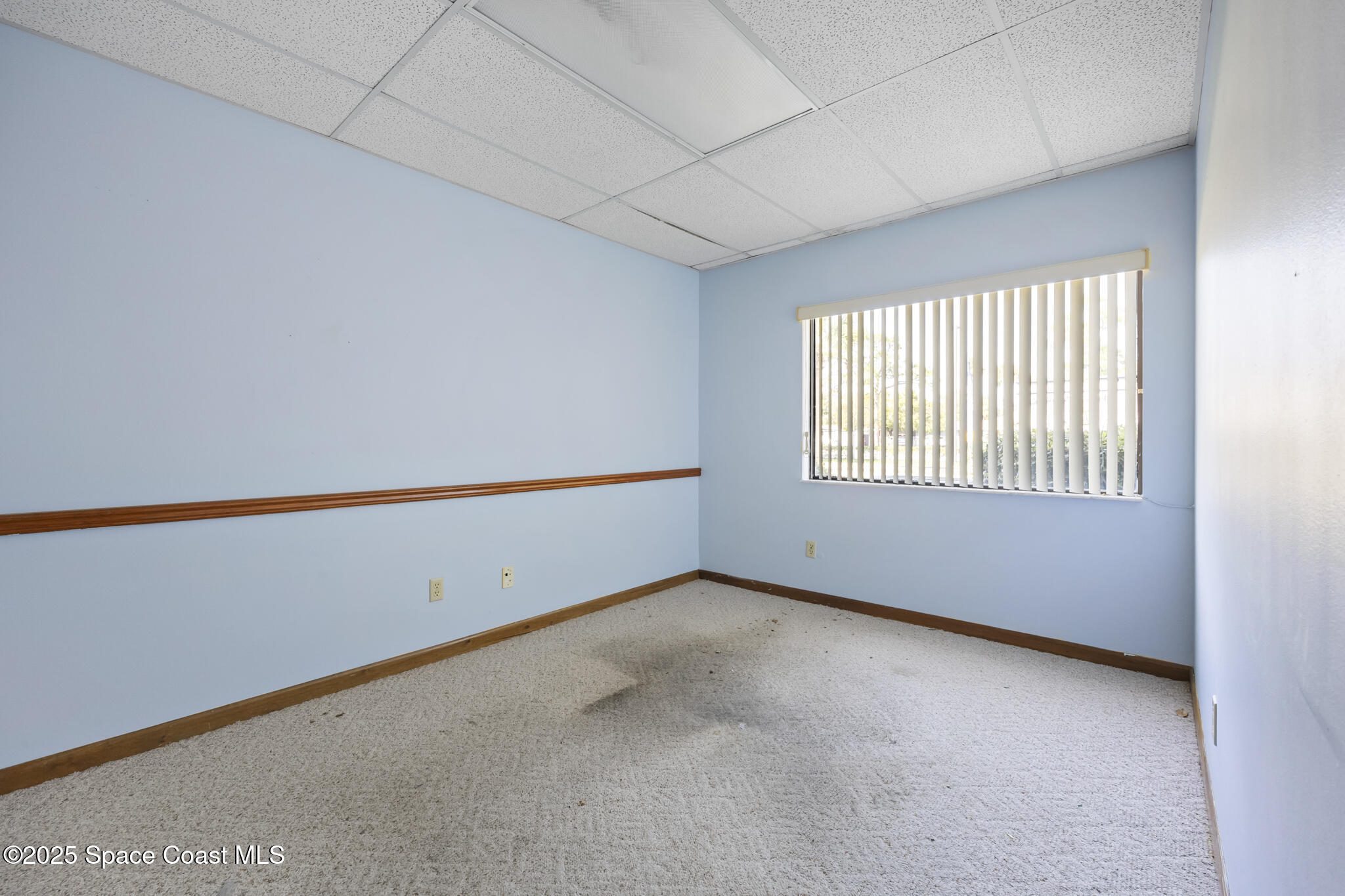 700 North Wickham Road, Unit 109 Melbourne, FL 32935 - Photo 11 of 13 a view of an empty room with a window