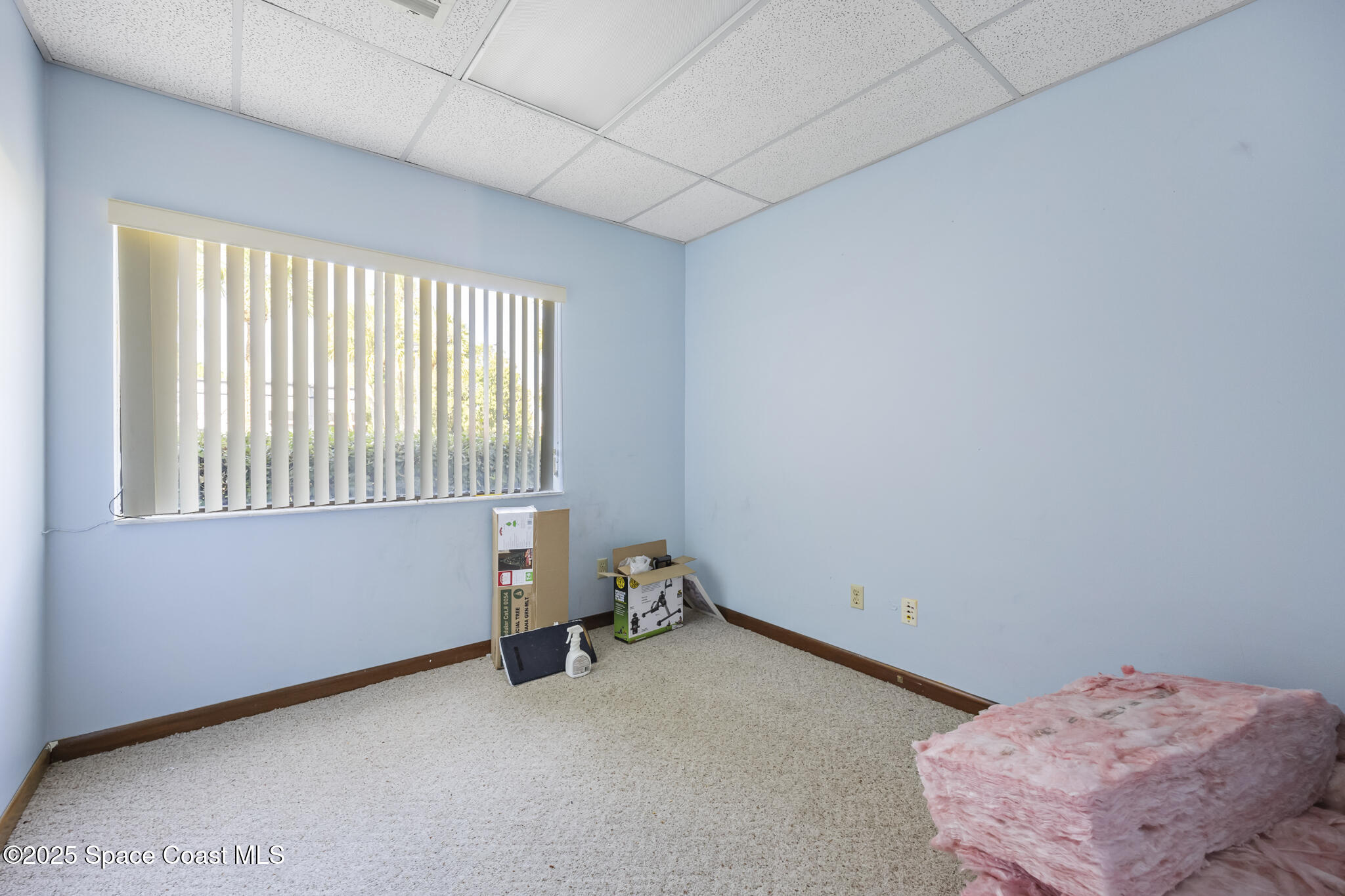 700 North Wickham Road, Unit 109 Melbourne, FL 32935 - Photo 12 of 13 a room with a window