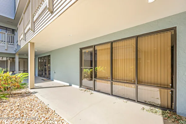 a view of a balcony with door