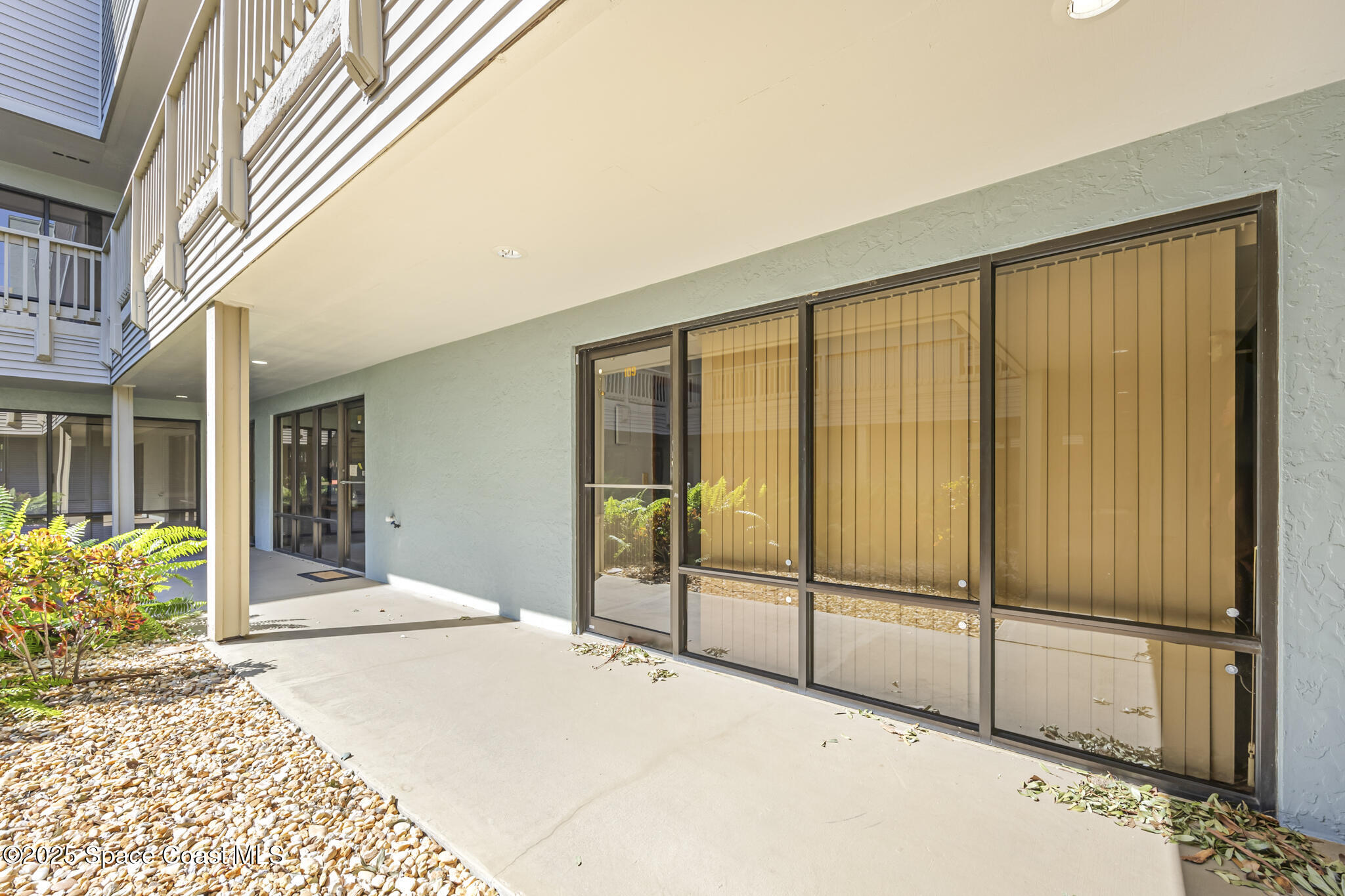 700 North Wickham Road, Unit 109 Melbourne, FL 32935 - Photo 4 of 13 a view of a balcony with door