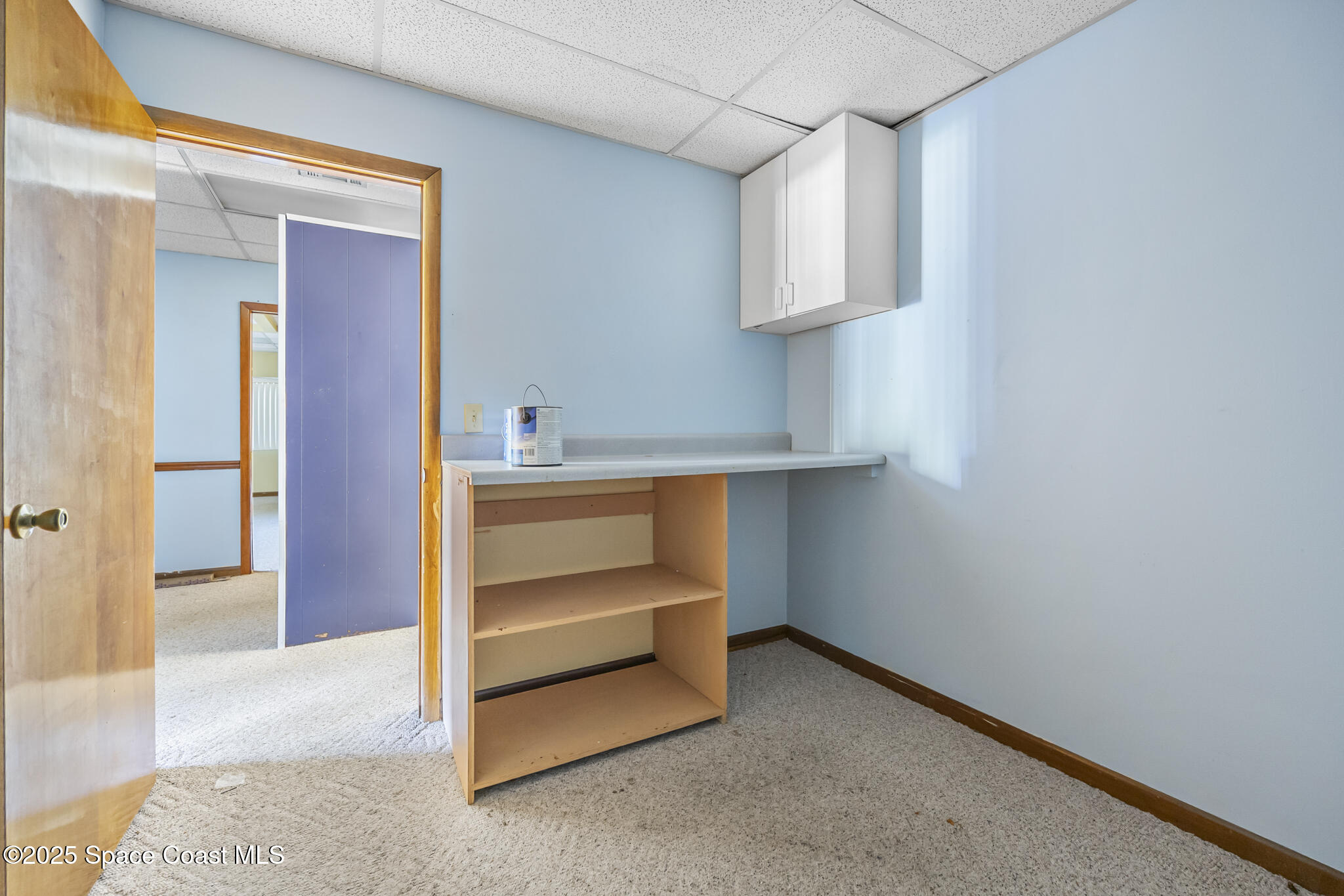 700 North Wickham Road, Unit 109 Melbourne, FL 32935 - Photo 9 of 13 a storage room with cabinets