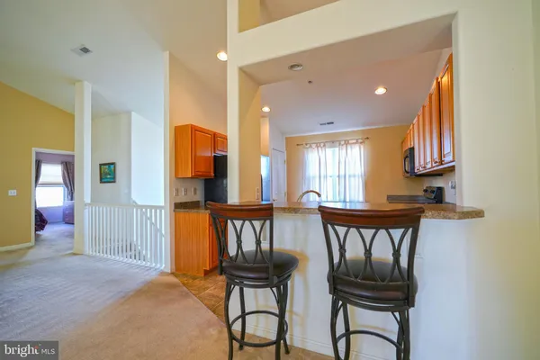 a view of hall way with furniture and window