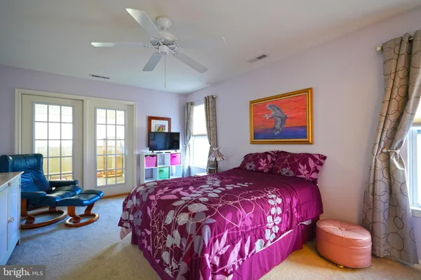 a bedroom with a bed and furniture