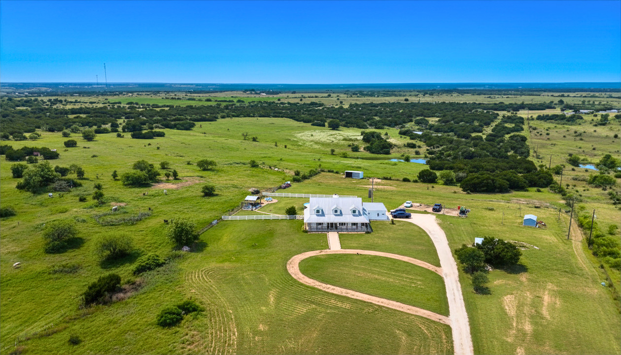 1283 Rattlesnake Trail Burnet, TX 78611 - Photo 2 of 39 a view of a lake with a yard