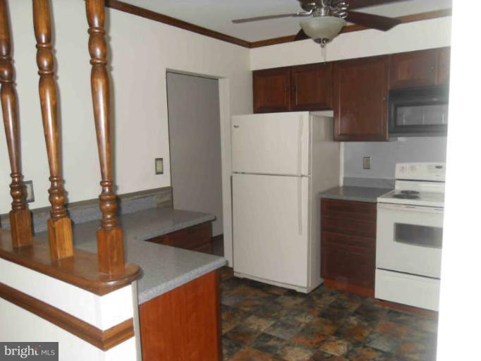 2921 Warehime Road Manchester, MD 21102 - Photo 13 of 30 a kitchen with a refrigerator and a sink