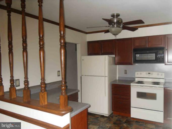 2921 Warehime Road Manchester, MD 21102 - Photo 17 of 30 a kitchen with stainless steel appliances a refrigerator and a stove top oven