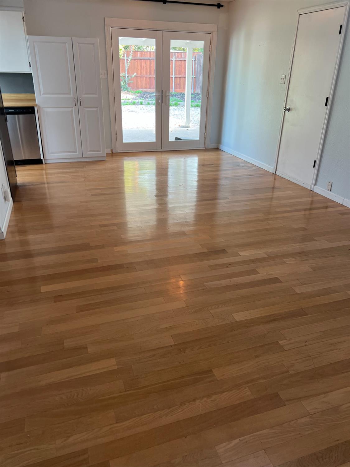 8024 Lesser Way Citrus Heights, CA 95621 - Photo 13 of 32 a view of empty room with window and wooden floor