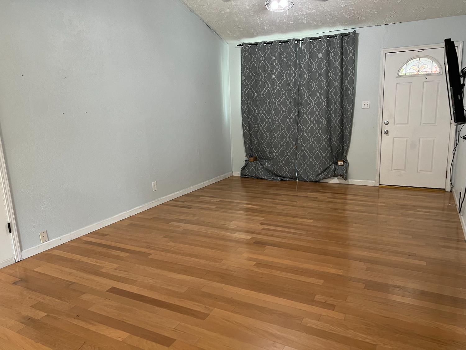 8024 Lesser Way Citrus Heights, CA 95621 - Photo 15 of 32 a view of an empty room with wooden floor