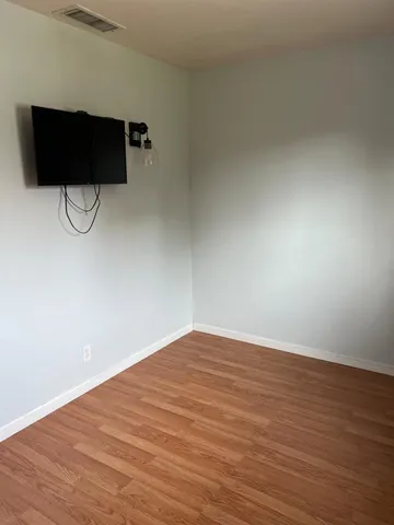 a view of a bathroom with shower and window