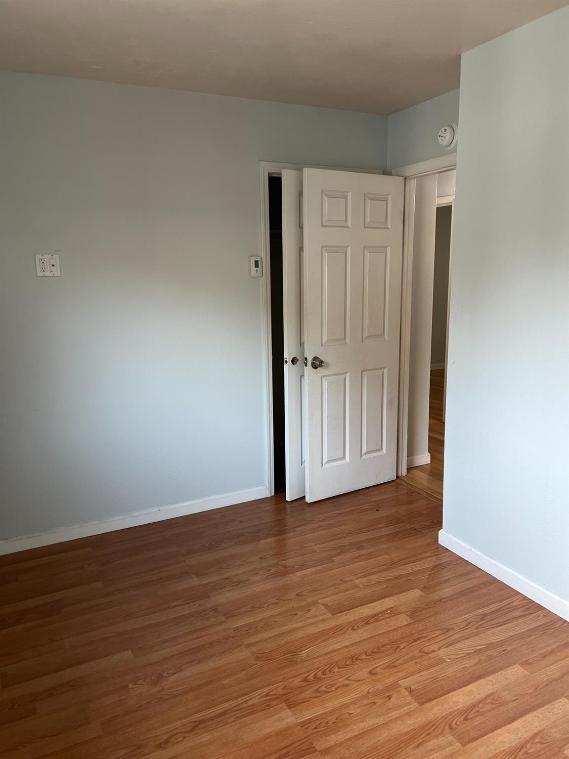 8024 Lesser Way Citrus Heights, CA 95621 - Photo 18 of 32 a view of an empty room with wooden floor