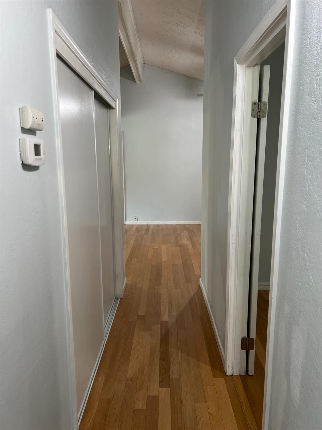 8024 Lesser Way Citrus Heights, CA 95621 - Photo 21 of 32 a view of a hallway with wooden floor